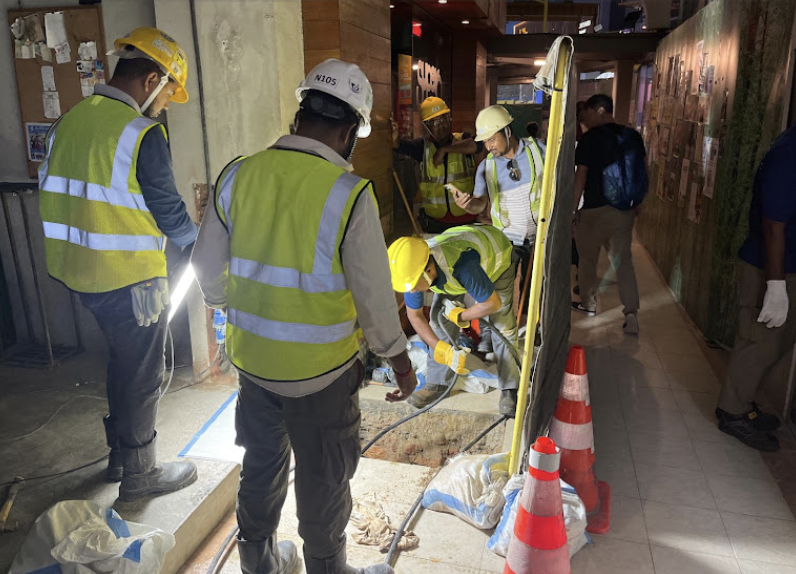 TNE Plumbing technician performing site work